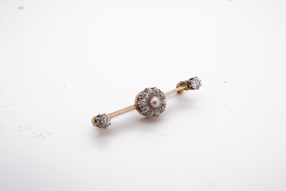 An early to mid 20th century yellow metal, split pearl and diamond cluster set bar brooch, 37mm, gross weight 4.3 grams. Condition - fair